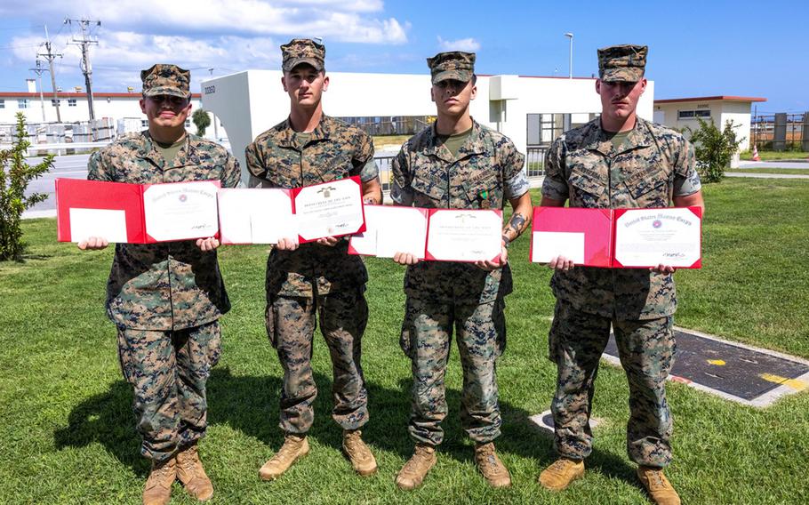 Three Marines and a sailor were awarded Navy and Marine Corps Achievement Medals or certificates of appreciation at Camp Schwab, Okinawa, Oct. 10, 2024.