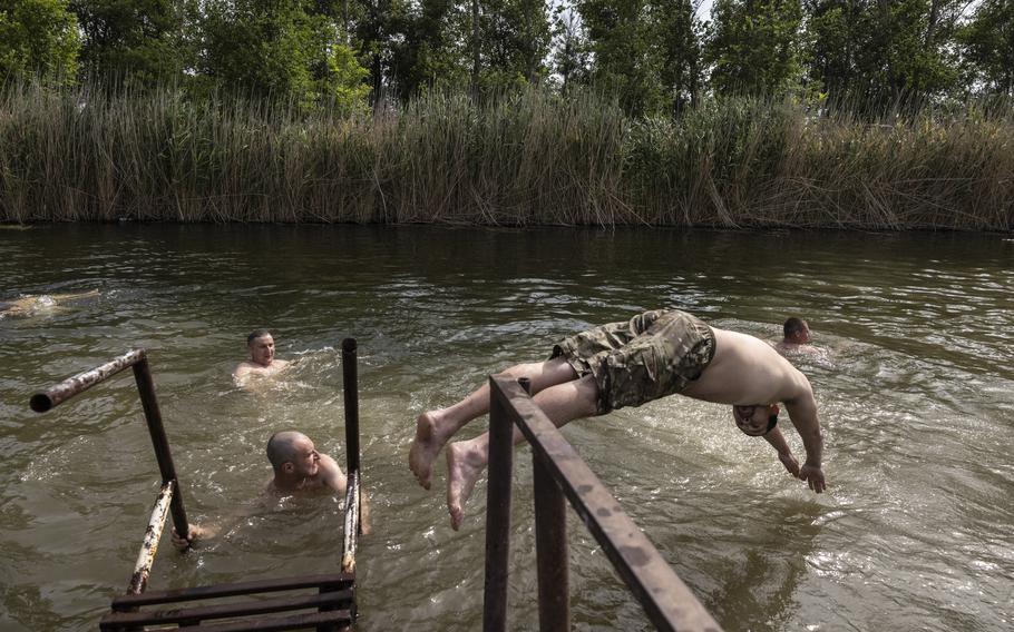 Soldiers relax and swim in a creek north of Velyka Novosilka, in an area where Ukrainians say they liberated several villages.