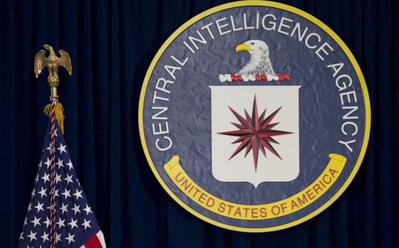 FILE - The seal of the Central Intelligence Agency stands next to a U.S. flag at CIA headquarters in Langley, Va. (AP Photo/Carolyn Kaster, File)