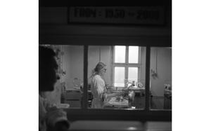 97th General Hospital, Frankfurt, Germany, Feb. 1, 1957: Unidentified nurse feeds a premature baby in its incubator at the 97th General Hospital Maternity Ward in Frankfurt, Germany. 

Read the 1957 article and see additional photos here. https://www.stripes.com/history/2023-04-11/usareur-hospitals-baby-care-9761289.html

META TAGS:  military medical; fixed medical treatment facility; way of life; hospital; pregnancy; maternity; health service support; military family; health care;