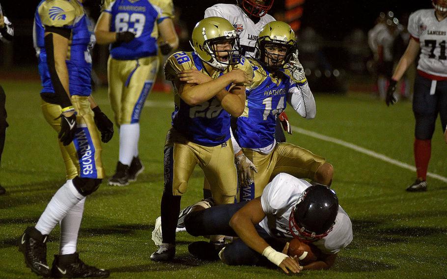 Wyatt Massey celebrates a tackle.