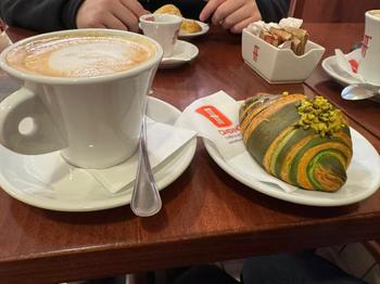 Pistachio Cornetto and Cappucinno on the table at Caffe Cammerino