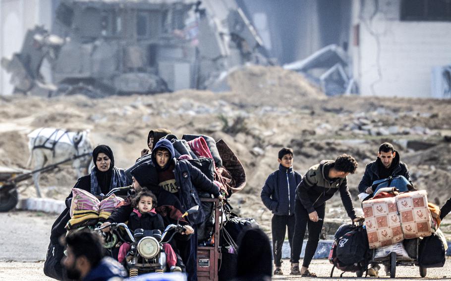 Displaced Palestinians flee from Khan Yunis in the southern Gaza Strip on Jan. 30, 2024, amid the ongoing conflict between Israel and the Palestinian militant group Hamas. 
