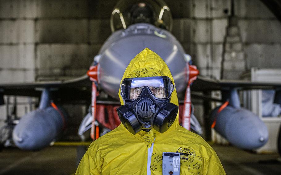 Tech. Sgt. Kayla Bradford waits for a radiological assessment on an F-16 Fighting Falcon