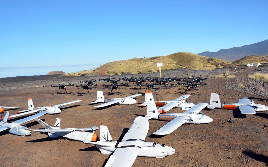 A small fleet of target drones awaits launching and ultimate destruction by the Marine Air Defense Integrated System, positioned atop the knoll in the background, during live-fire training at Pohakuloa Training Area, Hawaii, Jan. 25, 2025.