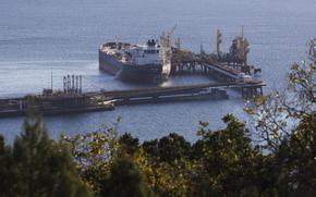 FILE - An oil tanker is moored at the Sheskharis complex, part of Chernomortransneft JSC, a subsidiary of Transneft PJSC, the largest facilities for oil and petroleum products in southern Russia, in Novorossiysk, Tuesday, Oct. 11, 2022. Russia's still making plenty of money from oil sales despite a price cap imposed by the Group of Seven major democracies. Researchers at Helsinki's Centre for Research on Energy and Clean Air said in report Wednesday Jan. 11, 2023 that the cap is too lenient at $60 per barrel. (AP Photo, File)