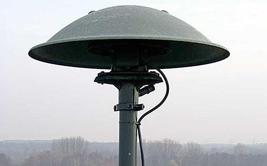 A photo of an outdoor warning siren.