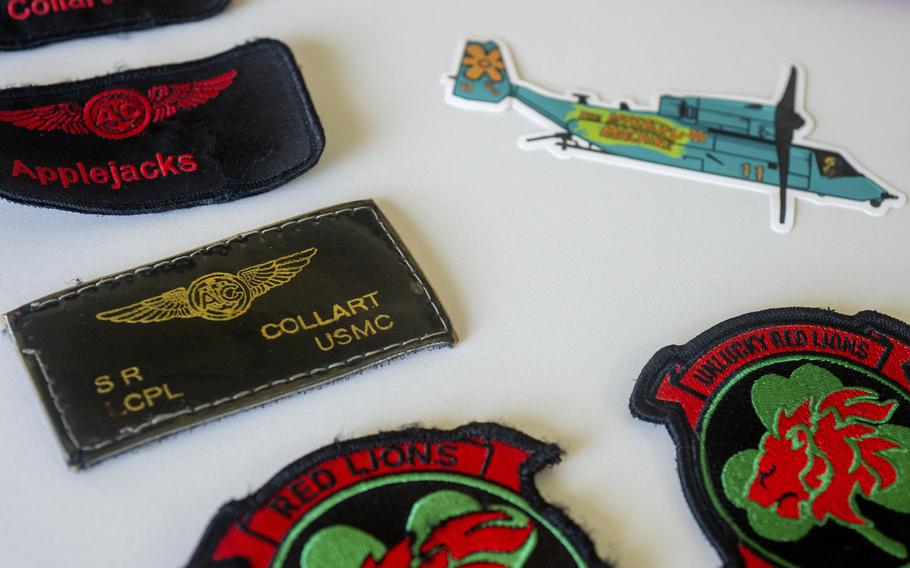 Marine Corps patches belonging to Cpl. Spencer R. Collart are displayed at his parents’ home in Arlington, Va., on June 19, 2024.