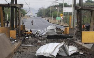 Wreckage after the explosion of a car bomb covers a toll area in Cucuta, Colombia, Thursday, Feb. 20, 2025. (AP Photo/Mario Caicedo)