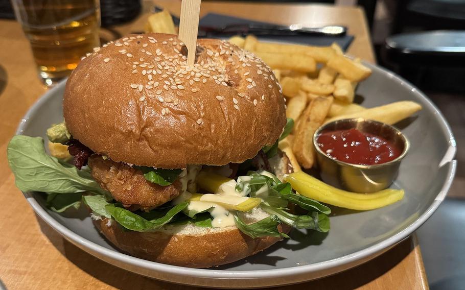 A burger and fries on a plate.