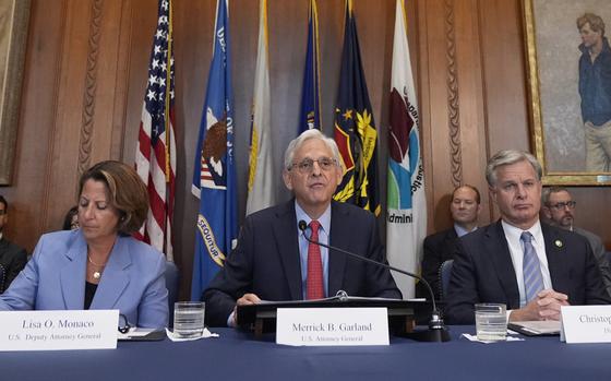 Attorney General Merrick Garland, center, speaks a meeting of the Justice Department's Election Threats Task Force in Washington on Sept. 4, 2024.