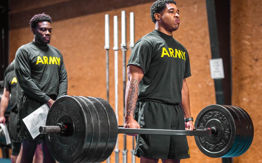 U.S. soldiers perform the deadlift during a fitness test.