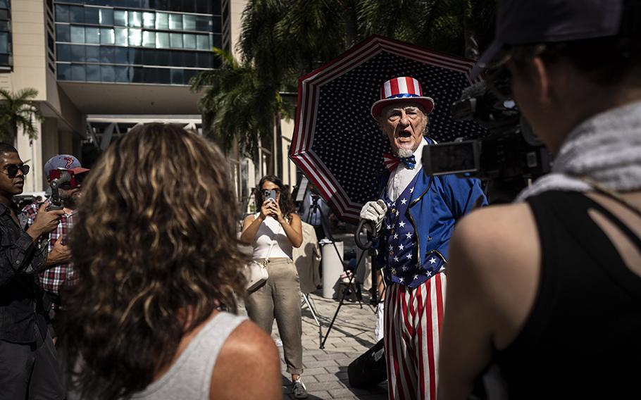 A man dressed as Uncle Sam shouts outside the Wilkie D. Ferguson Jr. U.S. Courthouse in Miami Florida, where former President Donald Trump was indicted on June 13, 2023.