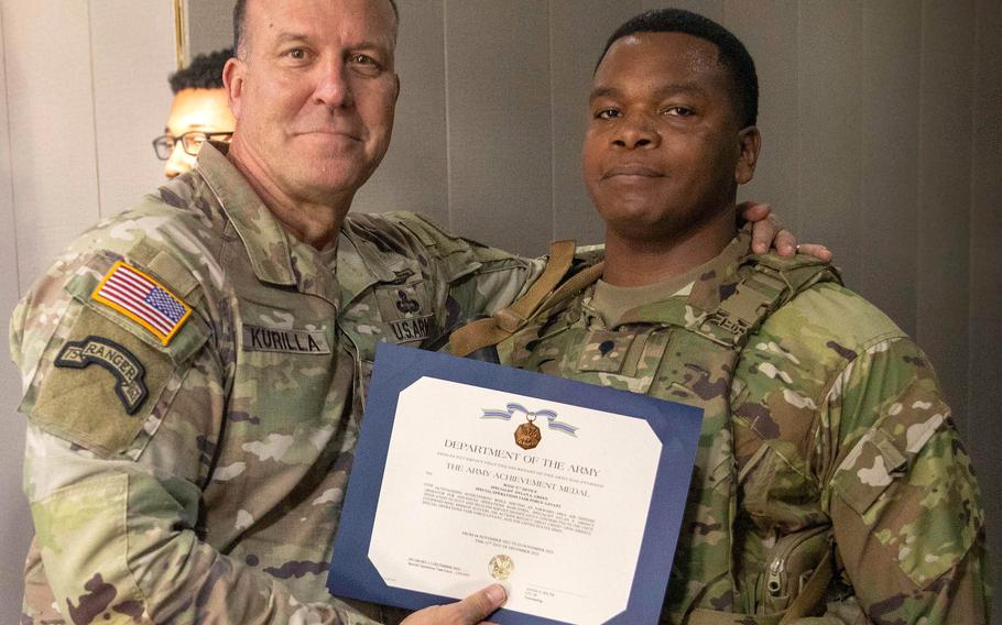 Gen. Michael Erik Kurilla, head of U.S. Central Command, presents an Army Achievement Medal with “C” Device to Spc. Dylan A. Green in December 2023.