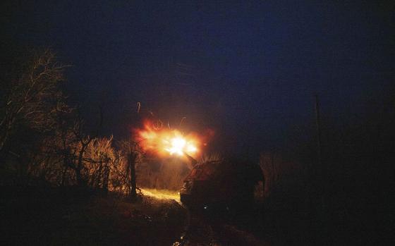 A Ukrainian AS-90 self-propelled artillery vehicle fires towards Russian positions at the frontline on Pokrovsk direction, Donetsk region, Ukraine, Wednesday, Dec. 23, 2024. (AP Photo/Evgeniy Maloletka)