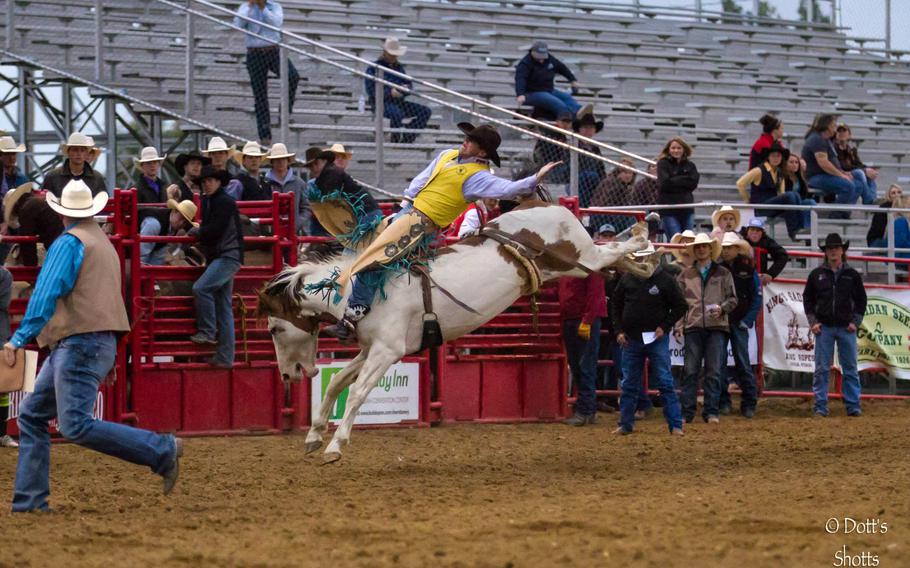 Jaden Clark competes for the University of Wyoming at the 2014 Sheridan College Rodeo in Sheridan, Wyo. Clark, a specialist with the Nebraska Army National Guards 1-134th Cavalry Squadron, is looking to earn his spurs, a rite of passage for cavalry scouts. 
