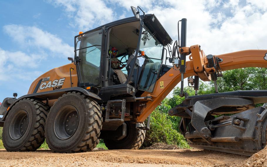 An airman uses a grader.