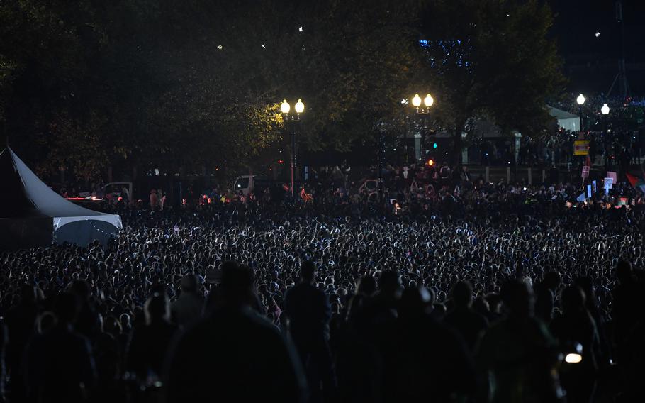 A crowd gathers at on the Ellipse in Washington ahead of a rally for Kamala Harris.