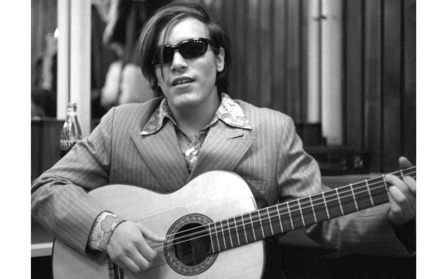 Singer Jose Feliciano warms up backstage between shows in Frankfurt, Germany, March 4, 1971.