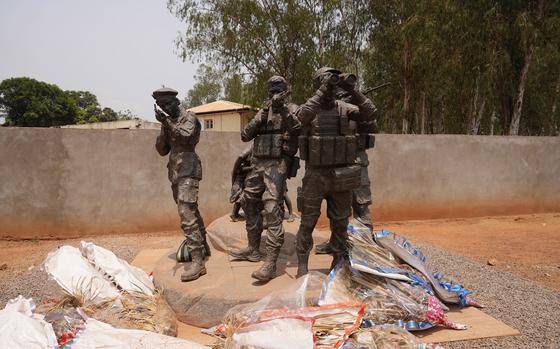 Flowers are laid at the statue of Russian mercenaries as a tribute to the late Wagner leader Yevgeny Prigozhin in Bangui, Central African Republic, on March. 5, 2024.