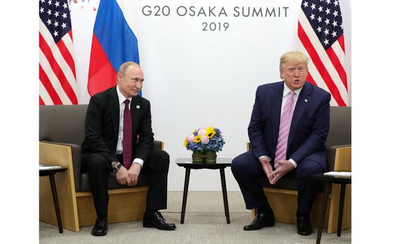 Russian President Vladimir Putin and US President Donald Trump hold a meeting on the sidelines of the G20 summit in Osaka on June 28, 2019. (Mikhail Klimentyev/AFP via Getty Images/TNS)