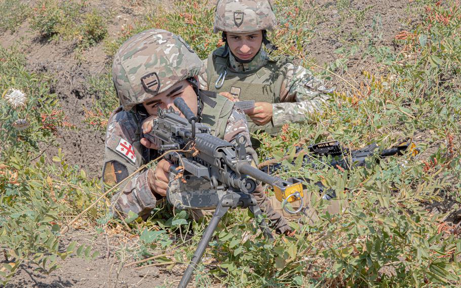 Georgian soldiers scan their sectors of fire during exercise Noble Partner at Vaziani Training Area, Georgia, in 2022. The Pentagon has canceled the U.S. Army’s largest exercise in Georgia over concerns that the country is involved in an anti-American misinformation campaign.