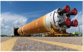 Move teams with NASA and Boeing position the massive rocket stage on special transporters to guide it onto the Pegasus barge on July 16, 2024, at NASA’s Michoud Assembly Facility in New Orleans ahead of its trip to Florida. (NASA/TNS)