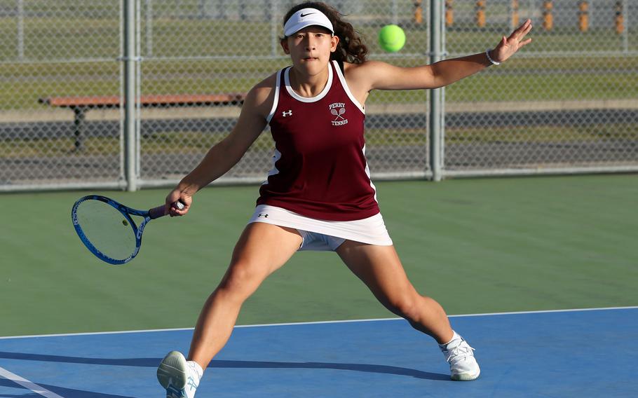 Matthew C. Perry's Sasha Malone prepares to striike the ball during this weekend's DODEA-Japan tennis matches. Malone won both her singles and doubles matches.