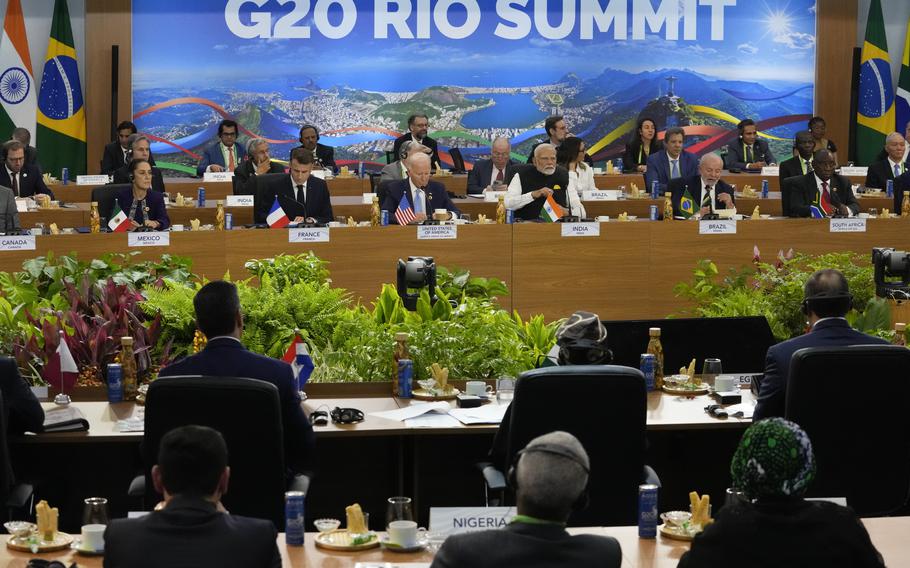 Leaders attend a meeting at the G20 Summit in Rio de Janeiro, Monday, Nov. 18, 2024.