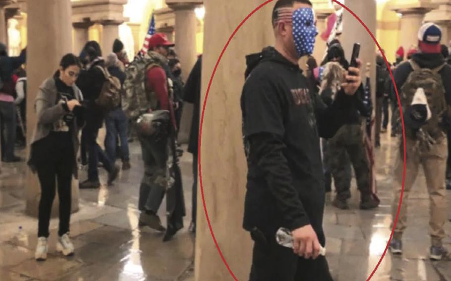 Capitol riot defendant Chad Suenram during Jan. 6, 2021, with a face mask painted with the American flag.