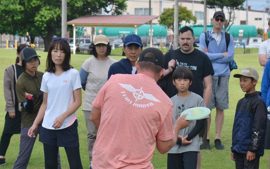 Nate Sexton, who won the United States Disc Golf Championship in 2017, demonstrates his forehand technique at Yokota Air Base, Japan, May 25, 2024.