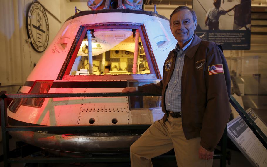 USS Hornet Museum trustee Bob Fish with the Apollo Block 1 command module aboard the USS Hornet aircraft carrier in Alameda, Calif., on Nov. 15, 2023. The Hornet was the recovery ship for the module when it was retrieved off Wake Island in the Pacific Ocean in 1966. 