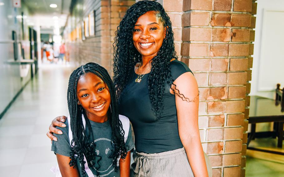 Cora Collins walks her daughter Londyn to her classroom on the first day of school Aug. 18, 2024, in Manama, Bahrain. Londyn said she was weary from jet lag after summer travels to Kansas City, Mo., and Olympic Town, N.C., but excited to reconnect with her third grade teacher who also transferred to Bahrain.