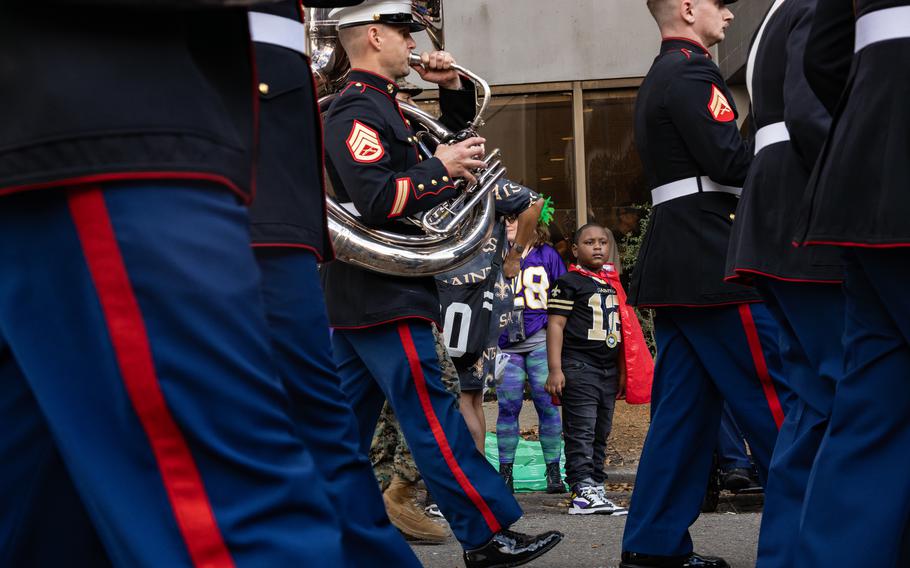 The Marine Forces Reserve Band marches through the city 