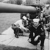 Members of the U.S. Naval Reserve apply a fresh coat of paint to the gun that fired the first shot at Pearl Harbor. Mounted on the deck of the USS Ward, the 4-inch gun sank a Japanese mini-submarine lurking near the harbor's entrance on Dec. 7, 1941. Kneeling in the foreground is Boiler Technician Maurice J. Hurley, who was aboard the Ward that morning. (Neale Van Ness / Pioneer Press)