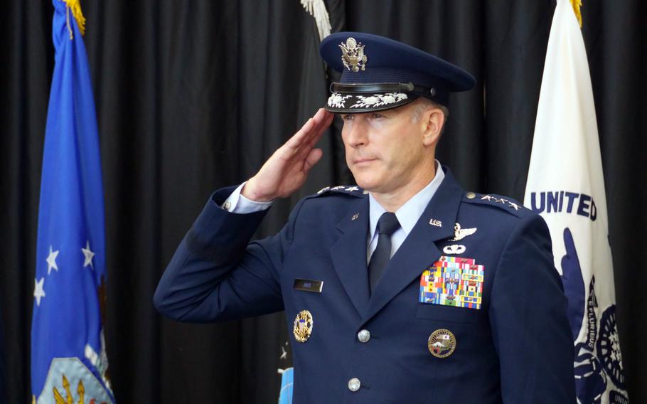 An Air Force general salutes during his change-of-command ceremony.