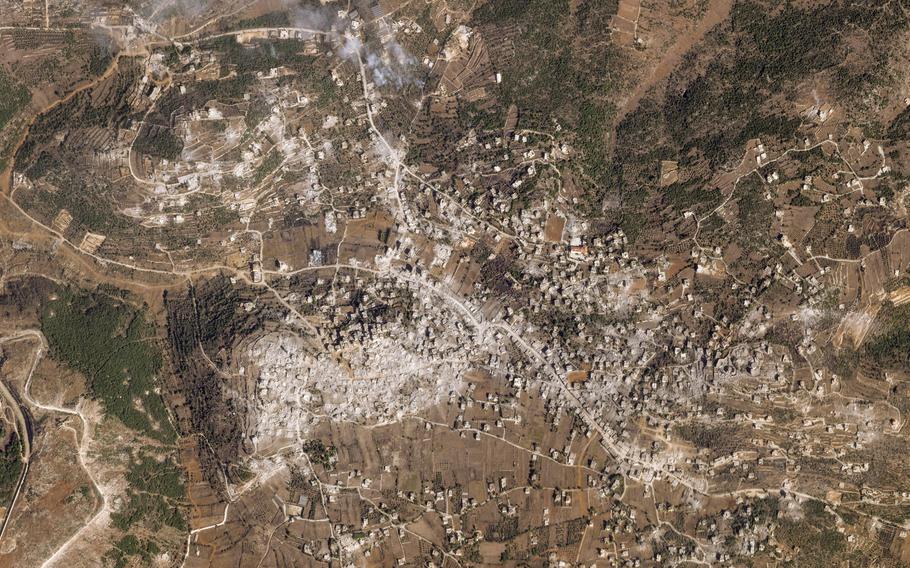 A satellite image of the Lebanese village of Aita al-Shaab, with a gray mass indicating the rubble of destroyed buildings.