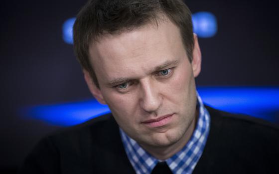 FILE - Russian opposition leader Alexey Navalny listens to a question during an interview at the Echo Moskvy (Echo of Moscow) radio station in Moscow, Russia, Monday, April 8, 2013. (AP Photo/Alexander Zemlianichenko, File)