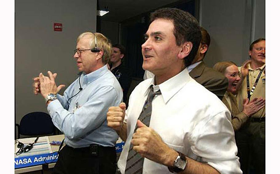 NASA official Firouz Naderi celebrates the landing of the Opportunity rover on Mars in 2004.