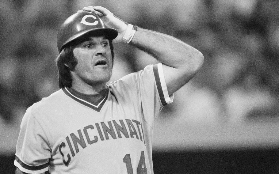 Pete Rose of the Cincinnati Reds watches as Pirates’ first baseman John Milner catches his third inning pop-up, Aug. 14, 1978 in Pittsburgh.