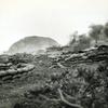 Marine amphibious tractors burn after being hit by Japanese mortar shells during the Battle of Iwo Jima in 1945.