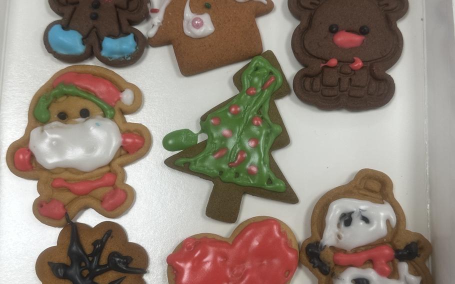 A set of Christmas cookies on a tray.