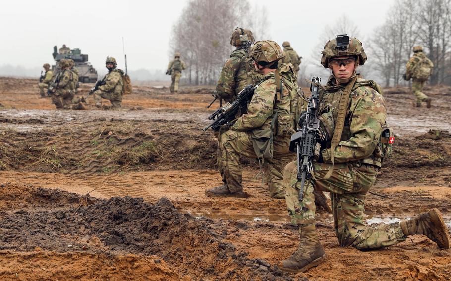 U.S. soldiers conduct security during a live-fire exercise at Bemowo Piskie Training Area in Poland on Feb. 28, 2024. Reduction or elimination of an American tank brigade and troop rotations to Europe could be on the table in a second Donald Trump administration.