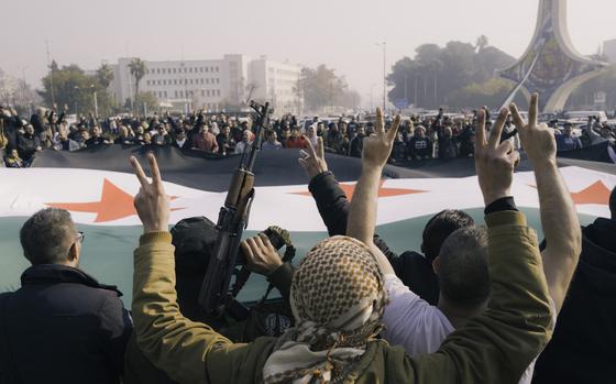 Syrians celebrate the fall of the Assad regime in central Damascus. (MUST CREDIT: Lorenzo Tugnoli for The Washington Post)