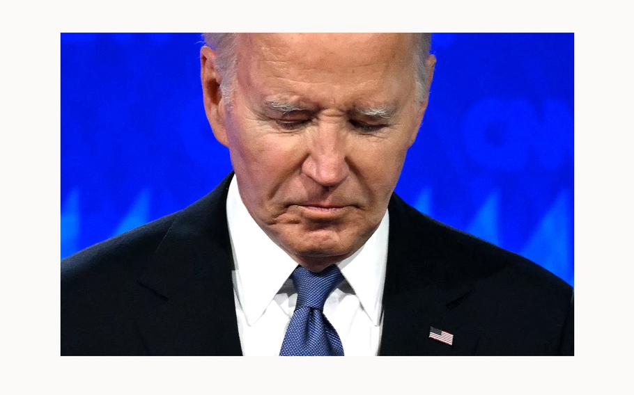 President Joe Biden looks down as he participates in the first presidential debate of the 2024 elections with former President and Republican presidential candidate Donald Trump at CNN’s studios in Atlanta, on June 27, 2024. 