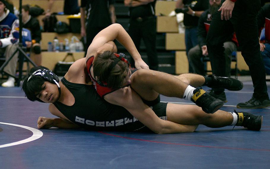 Kylejames Sigrah tries to hold onto Josh Mosteiko.