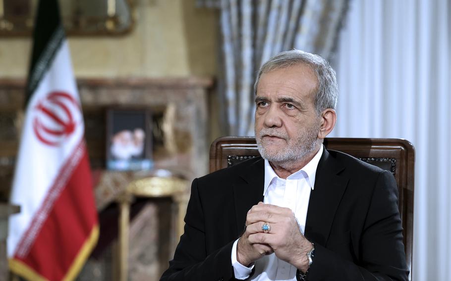 In this photo released by the Iranian Presidency Office, President Masoud Pezeshkian speaks in a live televised interview by state TV, at his office in Tehran, Iran, Saturday, Aug. 31, 2024.