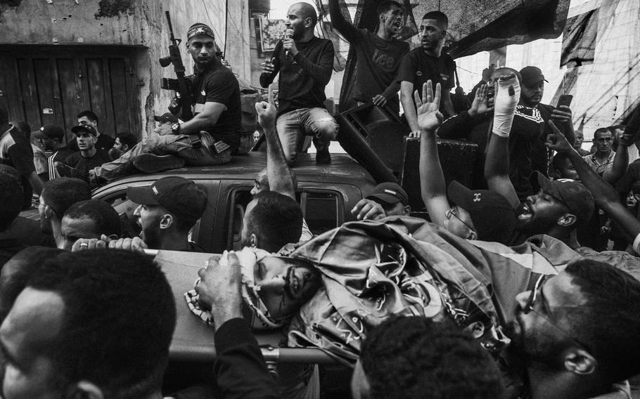 The funeral procession of a Palestinian killed during an Israeli raid in Nur Shams refugee camp in the West Bank on Oct. 20, 2023. 