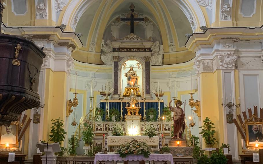 The interior of the Chiesa di Santa Maria della Pieta, or St. Mary of Mercy, on the island of Procida, Italy, is cozy but ornately decorated. 