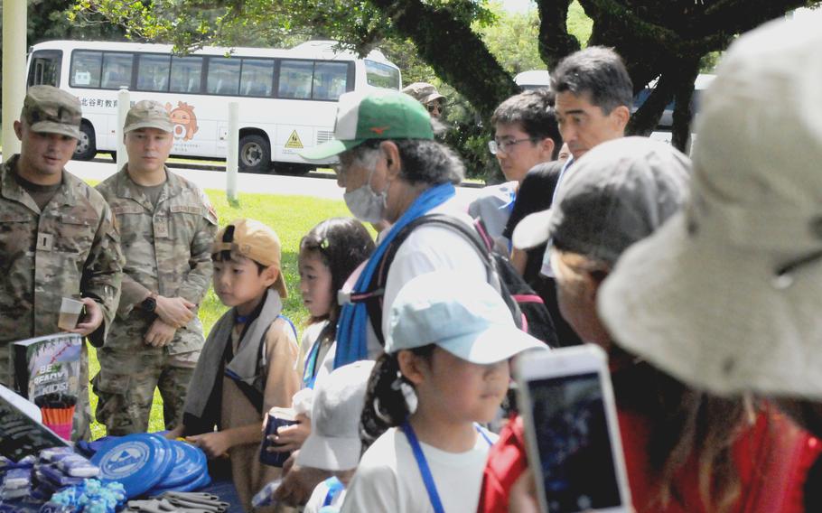 Chatan town residents queue for information and giveaways during a tsunami evacuation exercise at Kadena Air Base, Okinawa, Sept. 7, 2024. 